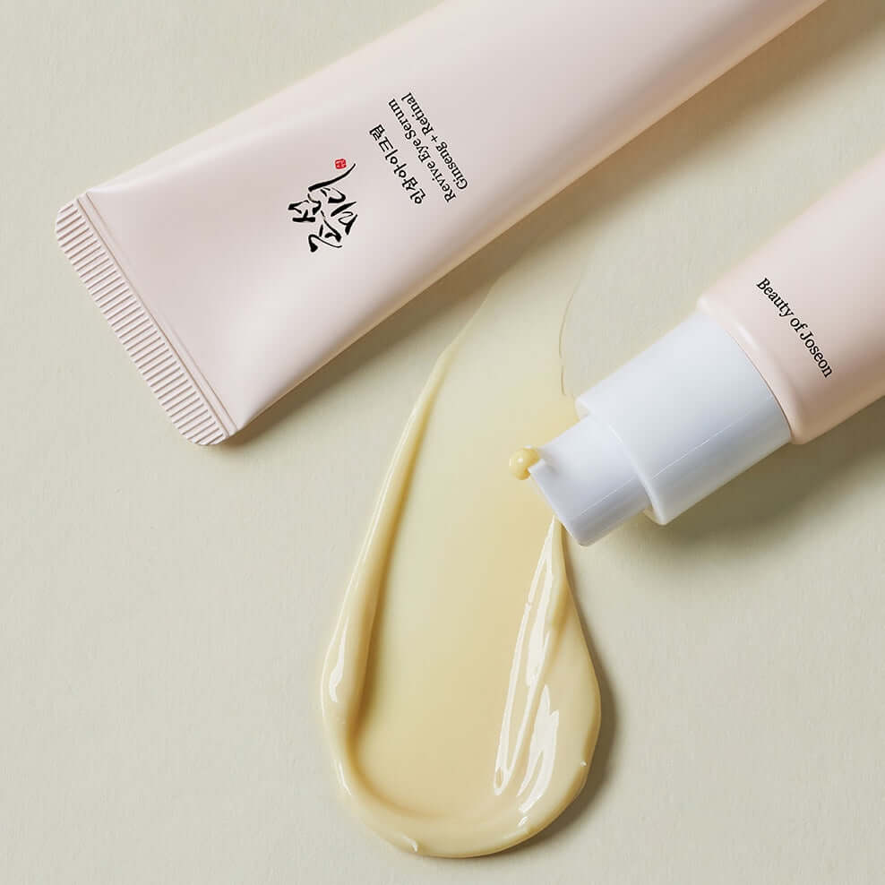 Beauty of Joseon Revive Eye Serum Ginseng+Retinal tube and serum drop on light background.