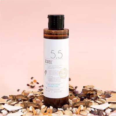Acwell Licorice pH Balancing Cleansing Toner on a backdrop of seeds and nuts, highlighting its natural ingredients.