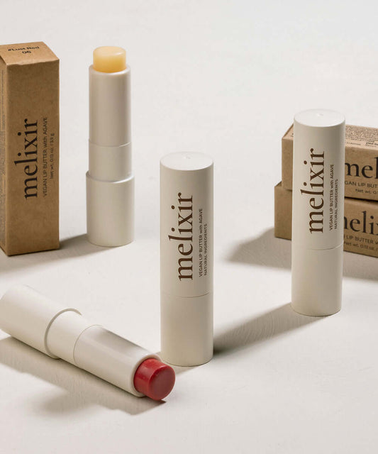 Melixir Vegan Lip Butter collection with moisturizing ingredients in eco-friendly packaging.