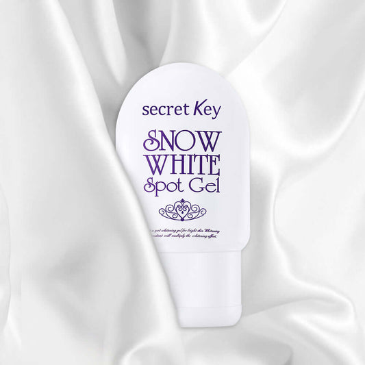 Secret Key Snow White Spot Gel packaging on a silky background, promoting skin whitening and soothing benefits.