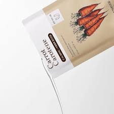 Skinfood Carrot Carotene Mask packaging featuring vibrant carrots, perfect for nourishing and hydrating skin.